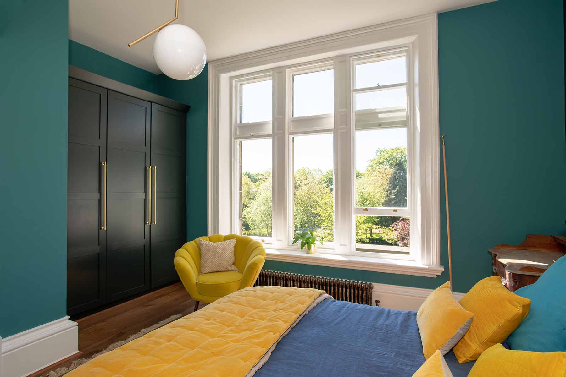 bedroom with tall sash window