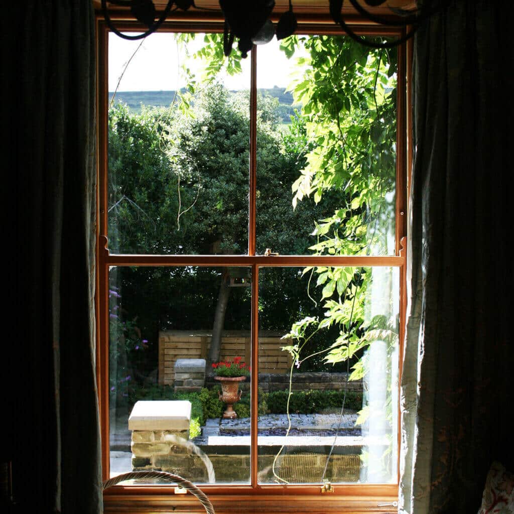 small brown frame sash window